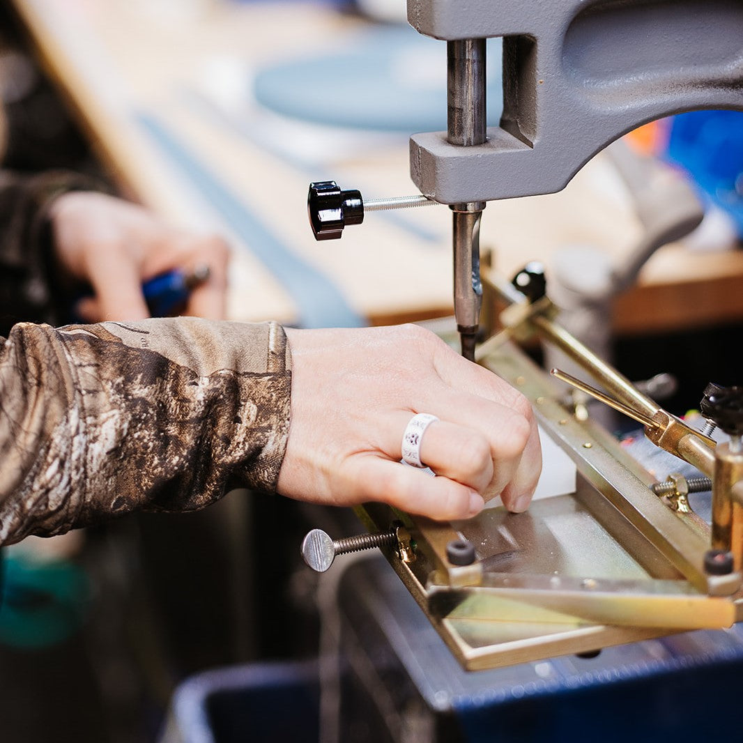 Person using a tool to create a BioThane item